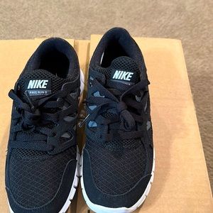 Black and white Nike shoes walking shoes